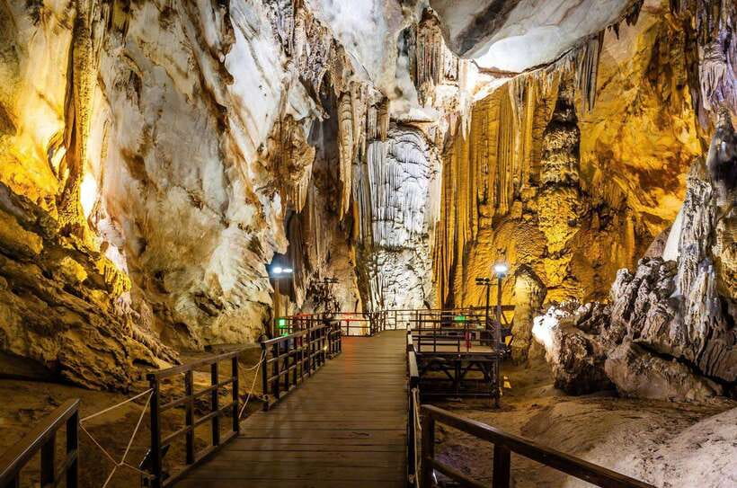From Hue: Paradise Cave and Dark Cave Day Tour - Dark Cave adventure: two-wire zipline over the Chay River, then head flashlights and a mud bath