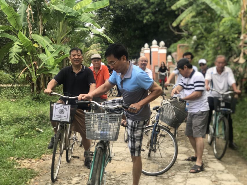 Hue: Thuy Bieu Village Bike Tour with Lunch - The first stretch along the Huong River