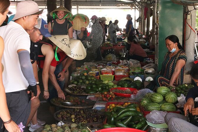 Private Cycling Tour in Rural Hue with Farming Experience - After lunch on the ancient tile-roofed bridge and near the market